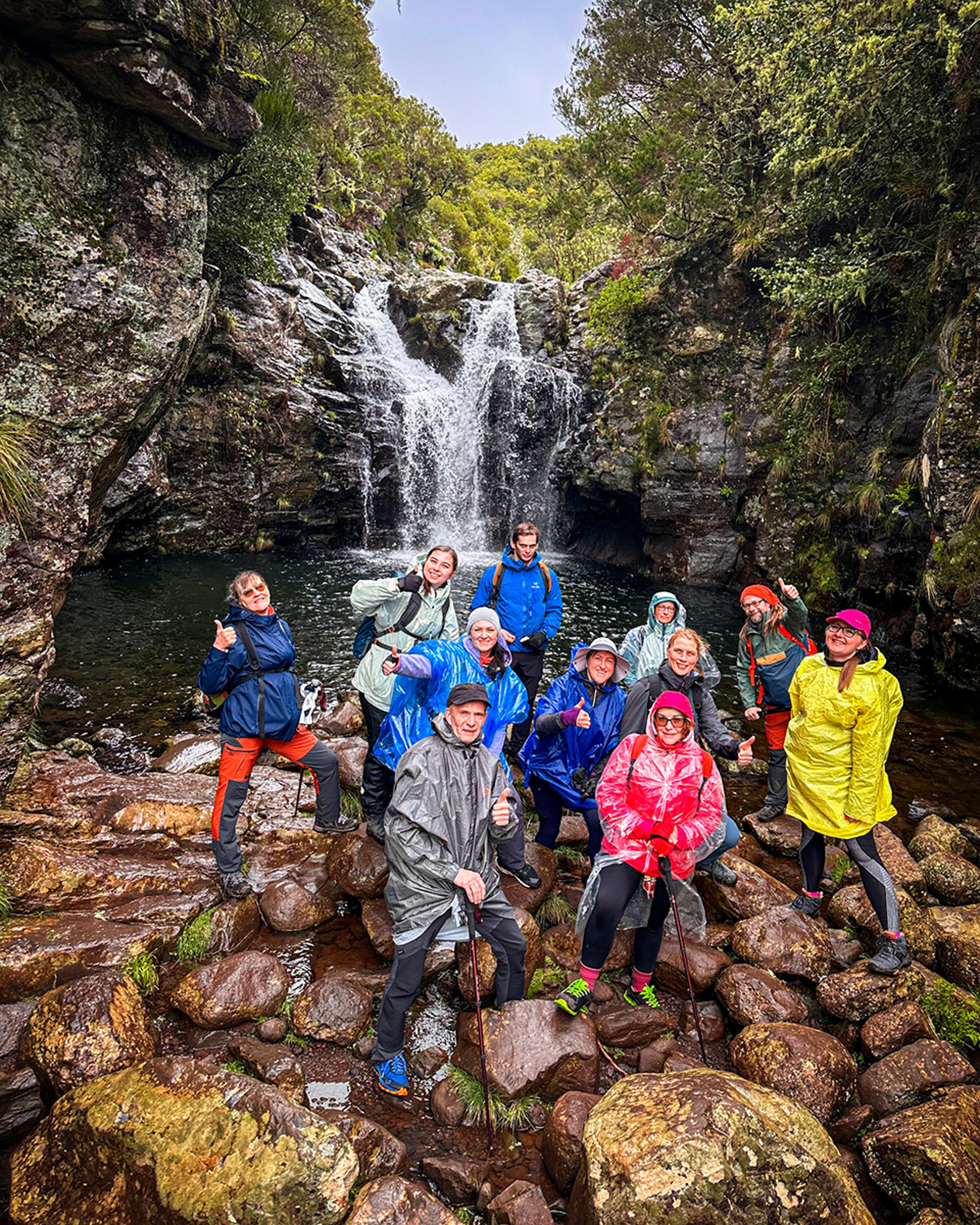 Hiking group at waterfall in Madeira